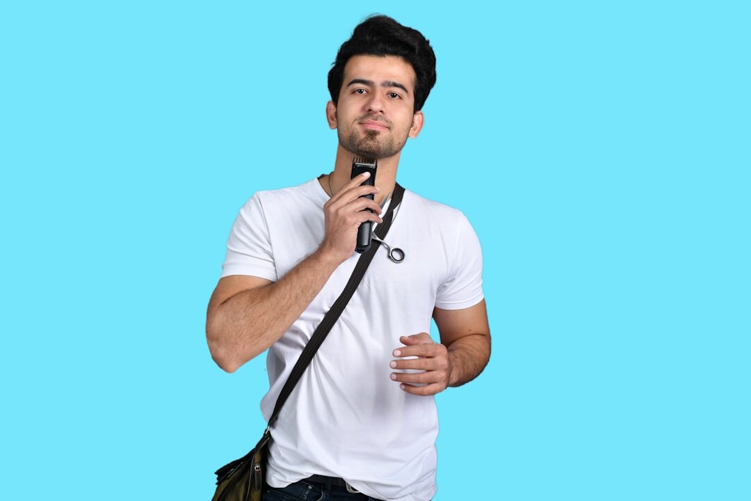 Man reporter holding a microphone confidently