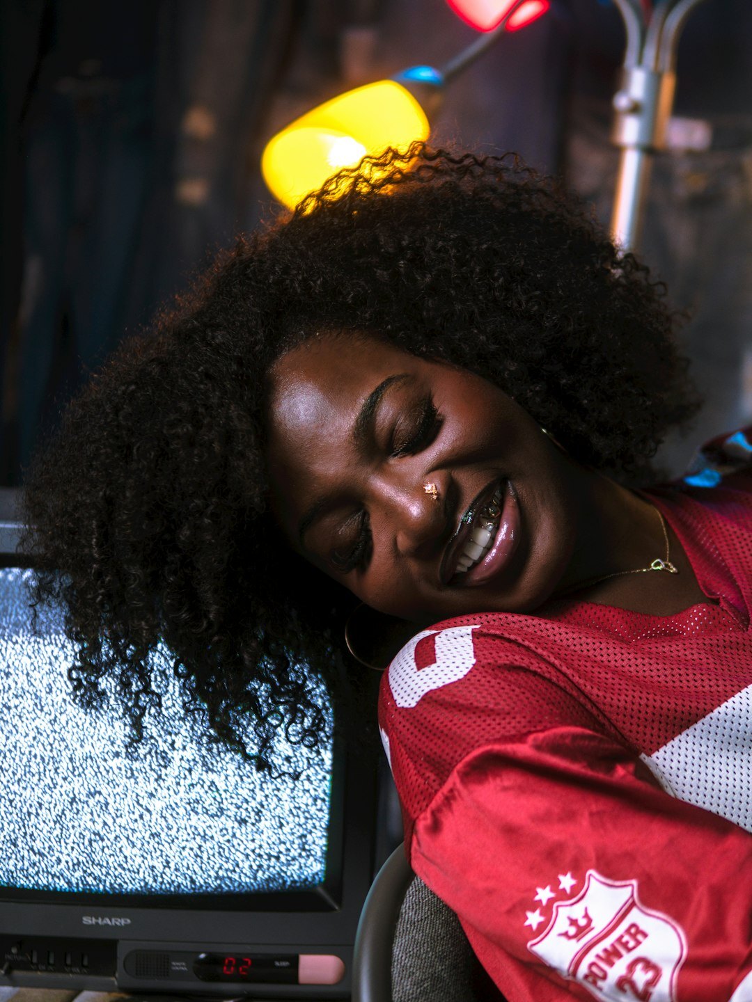 Smiling woman giving thumbs up in a TV studio